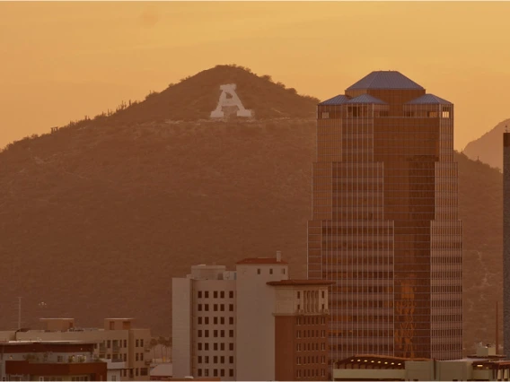 Image of downtown Tucson and A-Mountain as the sun sets